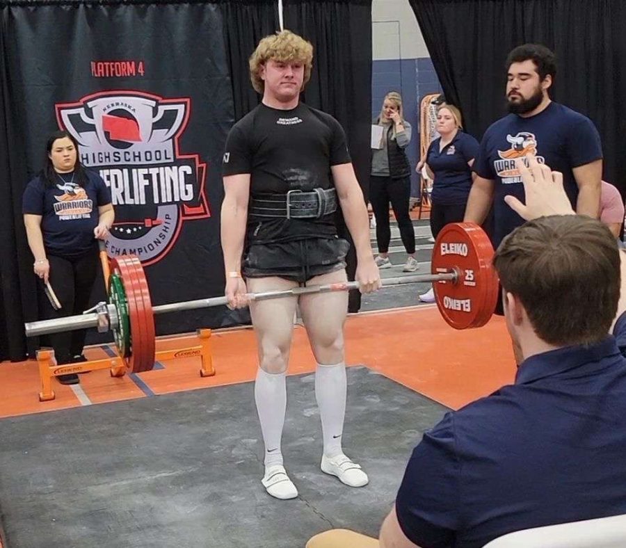 Junior Max Peterson finishes a deadlift at the state powerlifting meet in Fremont. The state meet was only Petersons second time competing in the sport.
