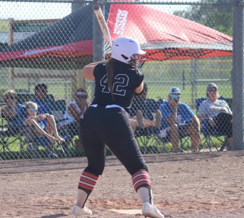 Senior Kaitlin Hansen gets ready to swing at a ball. Hansen played softball for eleven years and decided not to play in college due to injuries. 