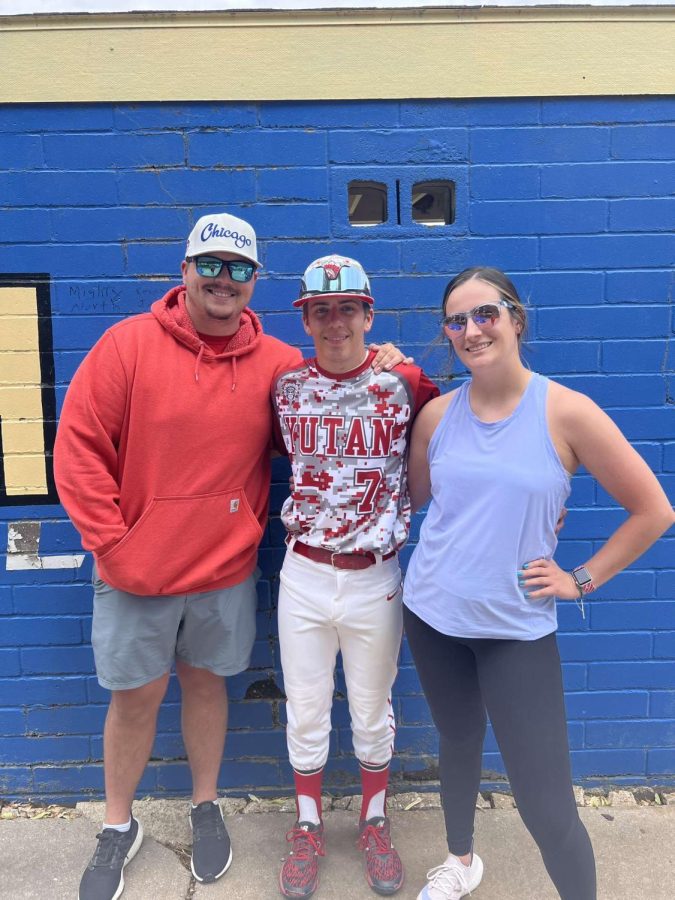 Senior Janson Pilkington smiles with his siblings, Carson and Payton Pilkington, after a baseball game. Pilkington was the only one out of the three siblings to attend Yutan.
