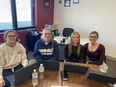 Courtney Stevens, Andi Nelson, Bella Tederman, and Maura Tichota worked in a group together in the Junior Achievement Stock Market Challenge. Their team invested in four different stocks and placed 3rd overall. 