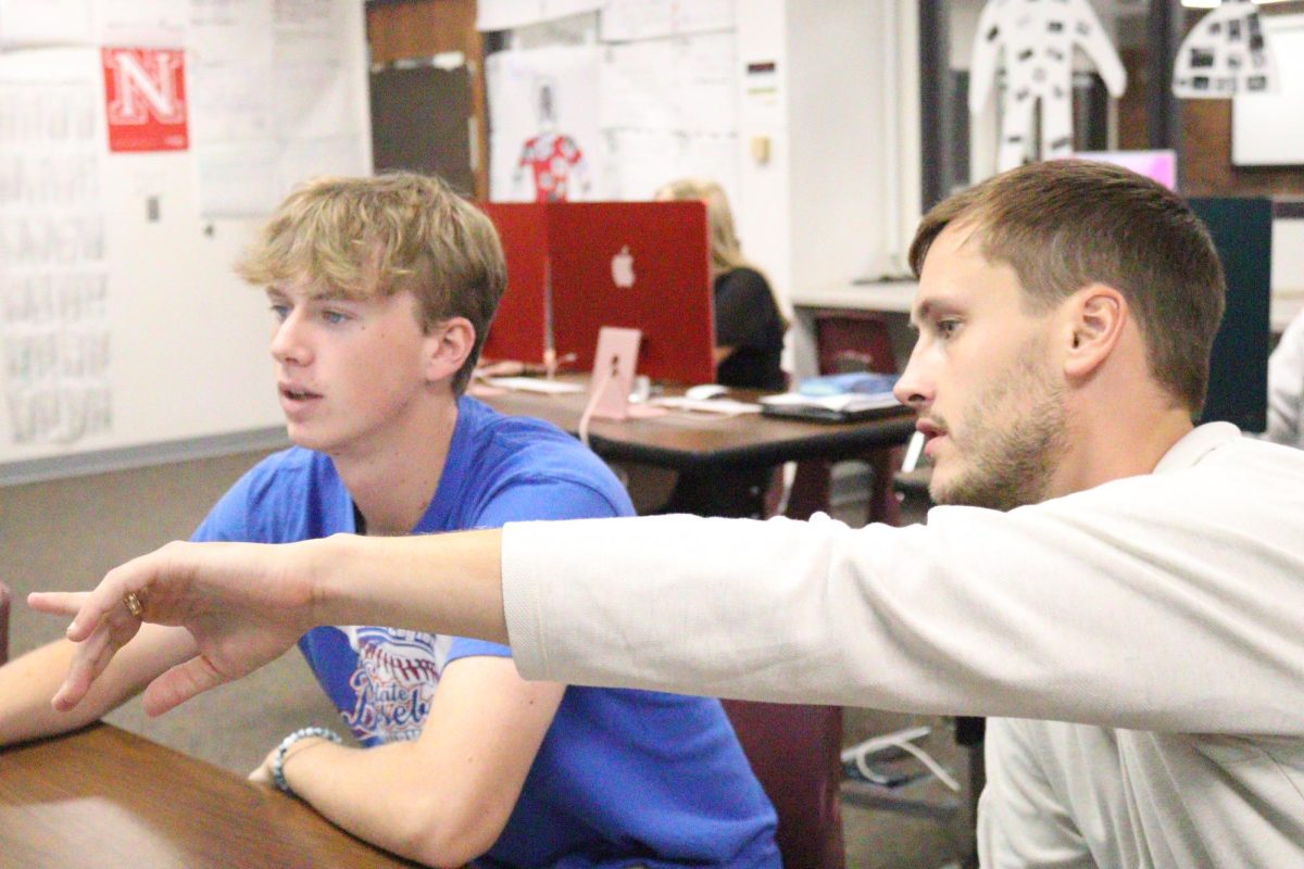Technology teacher Hunter Vanness helps student Jack Edwards with his Striv work. Vanness teaches Computer Science, Media Production, JH Keyboarding, Striv, Marketing Management and Digital Media. 
