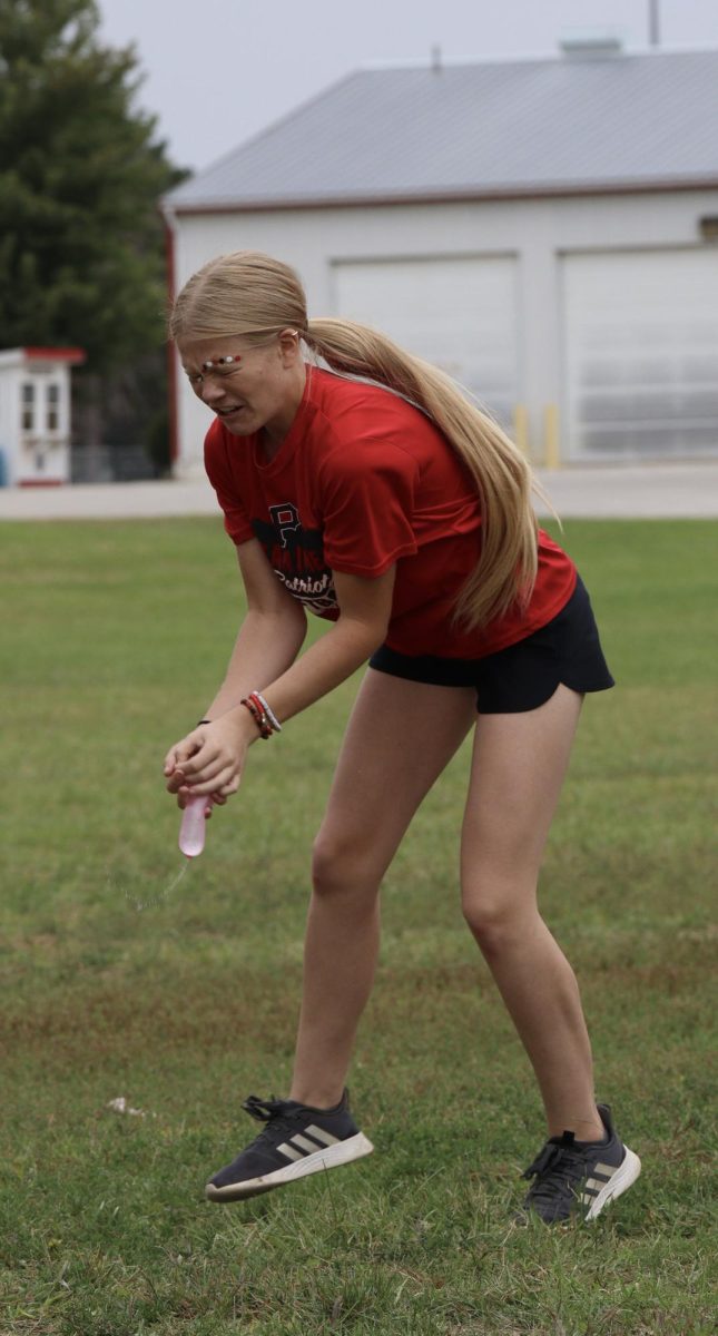 Sophomore Adie Gale catches a water balloon that almost slips through her fingertips. The sophomore class ended up getting first in the 10-12 grade division of the water balloon toss. “This was the first year that I did the water balloon toss, and I really enjoyed it,” said Gale.