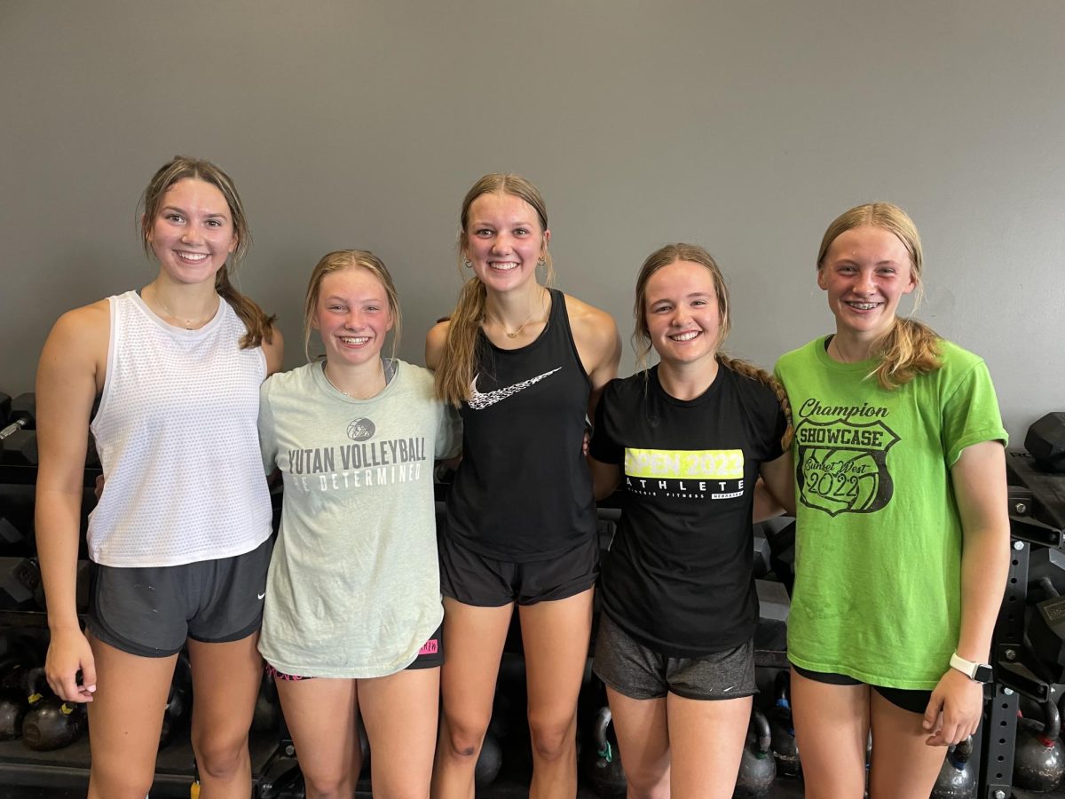 All five athletes pose together after their workout together over the past summer. These athletes trained together over the summer at Crossfit Kinesis
