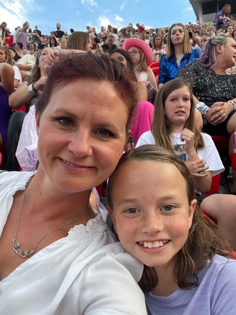 English teacher Nealy Freeman and her daughter Daisy smile for the camera. The two, along with Freemans boyfriend attended the Kansas City leg of Taylor Swifts Eras Tour.
