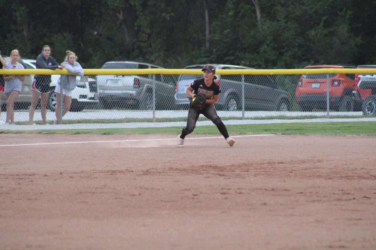 Senior Maycee Hays fields a ground ball while moving to throw to first base. Hays has committed to play softball at the College of Saint Mary next year.