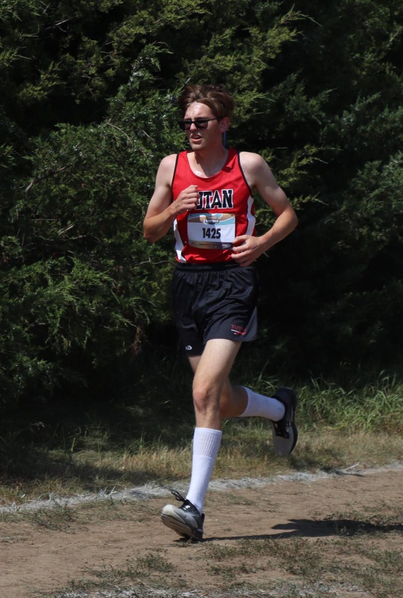 At the Pender cross country meet, senior Bryce Kolc looks towards the finish line. Kolc placed twelfth at the meet.   