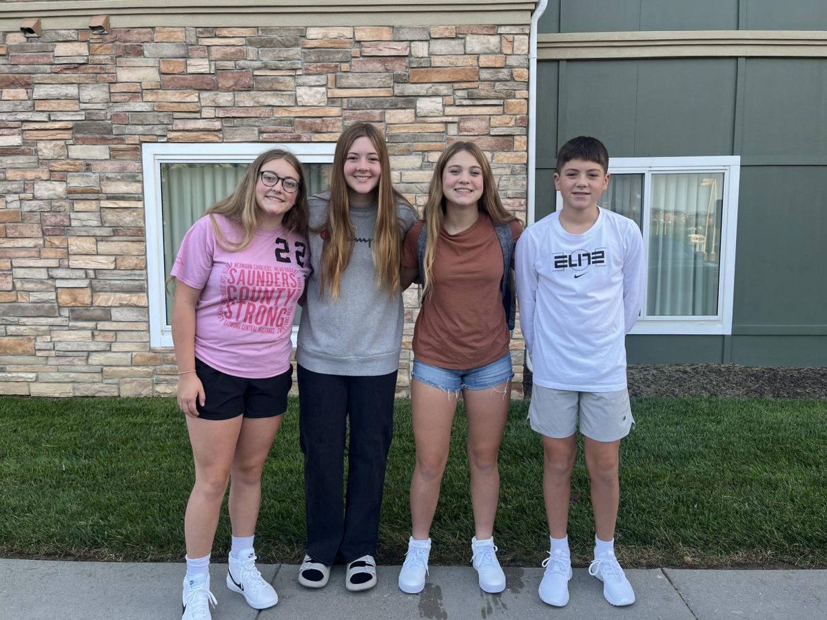 From left to right, Reagan, Madison, Mallory, and Rhett Wilson stand in front of Residence Inn Hotel. By the time their house is done, the Wilsons wouldve stayed in the hotel for six months.
