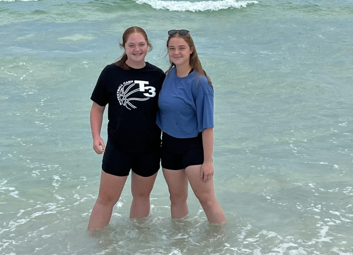 Sophomore Addi smith poses with her sister eighth-grader Kinsley Smith. This was their first time experiencing the ocean.