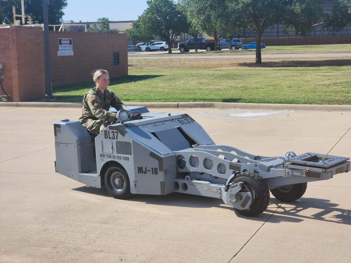 Frankie Hendricks operates a bomb lift. This Aerospace Ground Equipment (AGE) is used to load ammunitions onto an aircraft. 