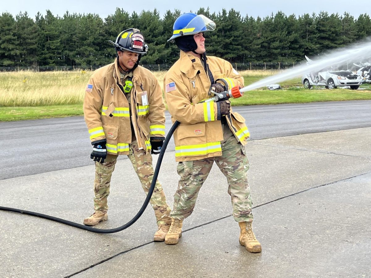 Allan Cramblitt practices operating a hose during training. While most overseas assignments last only three years, Cramblitts service was extended to last four years. 