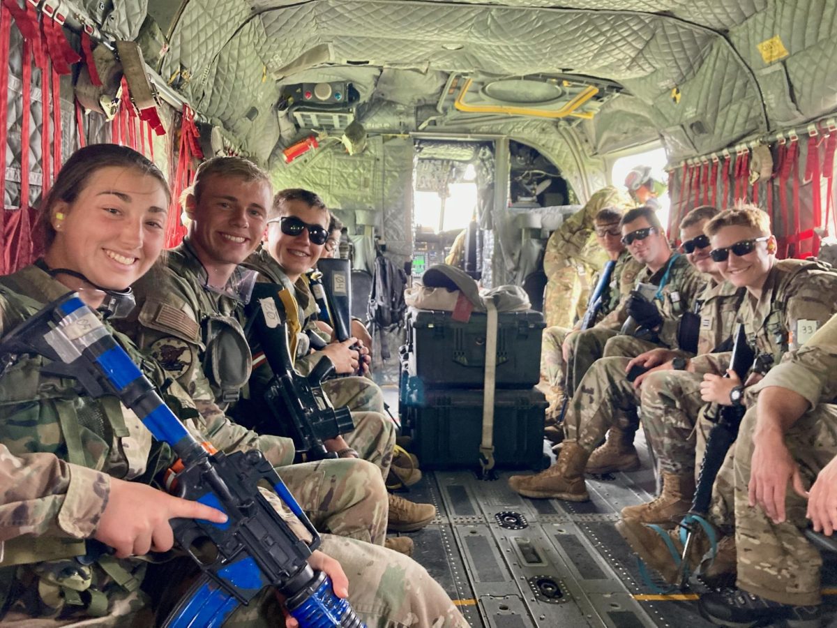 Carter Tichota (third from left) sits in a Boeing CH-47 Chinook on the way to a mission scenario with his fellow cadets. Tichota was also able to fly in a UH-1 Huey during his two weeks in SWOC.