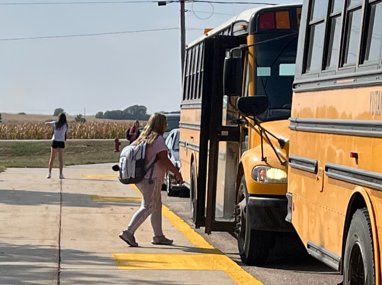 Seventh grader Tory Daywood gets onto the bus after school to go home. Daywood lives outside of Yutan and has a 20 minute bus ride to get home. 