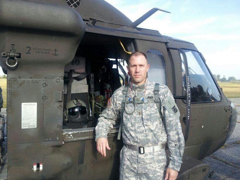 While at Fort Lee, Va., during Basic Officer Leadership Course, Mark Ray poses for the picture in front of the helicopter. At this course, Ray learned how to properly package and bundle boxes so the helicopters could pick up and transport them by air.