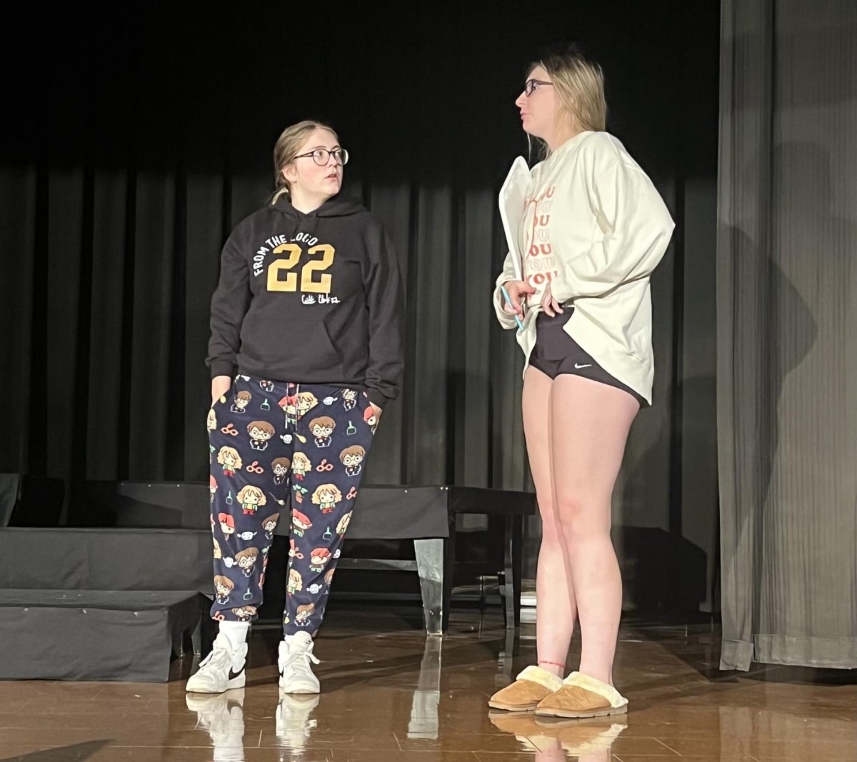 Seniors Reagan Wilson and Andi Nelson act out a scene at one act practice. Actors practice three times a week.