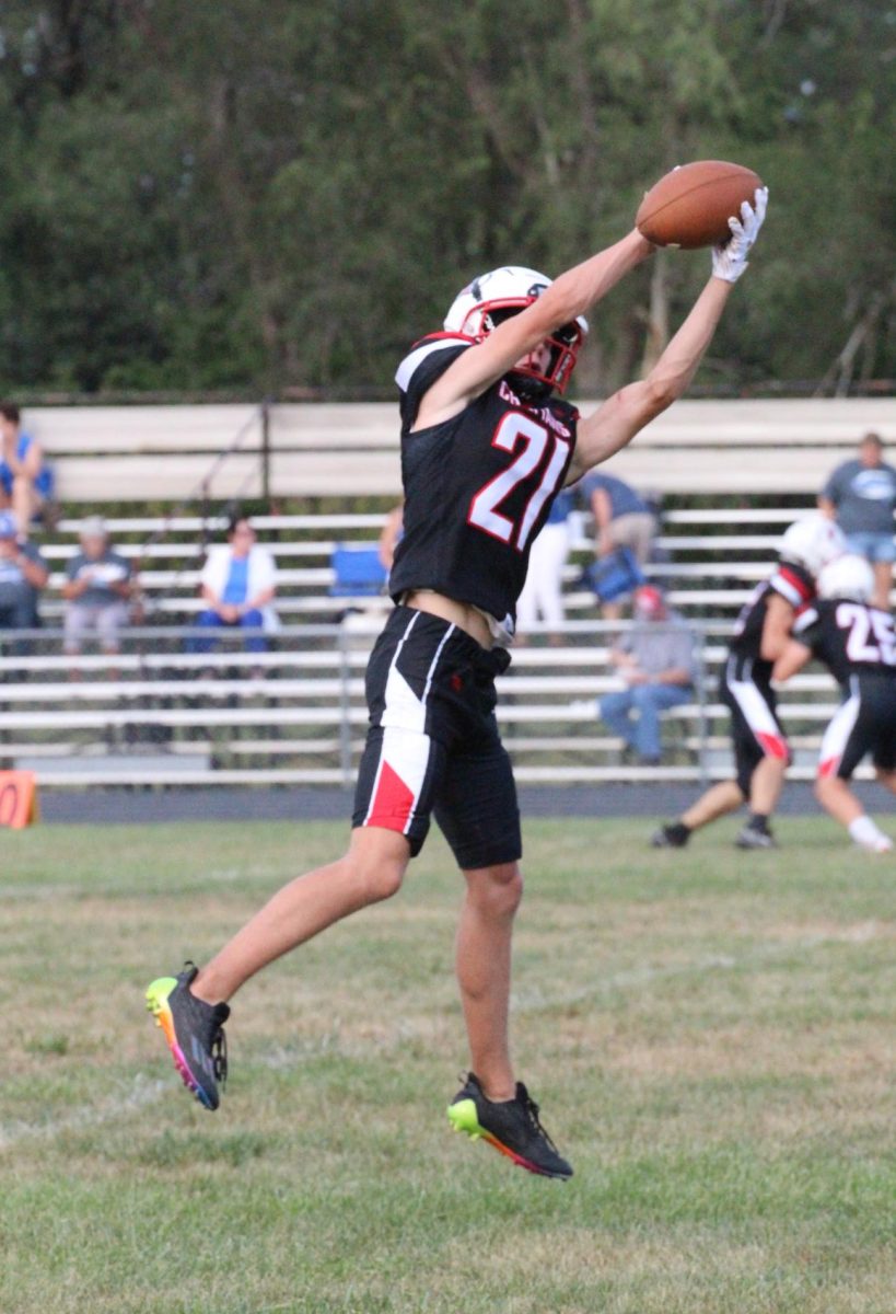Sophomore Maddox Wentworth catches the football during warm up. Wentworth is a x for the Yutan Chieftains.