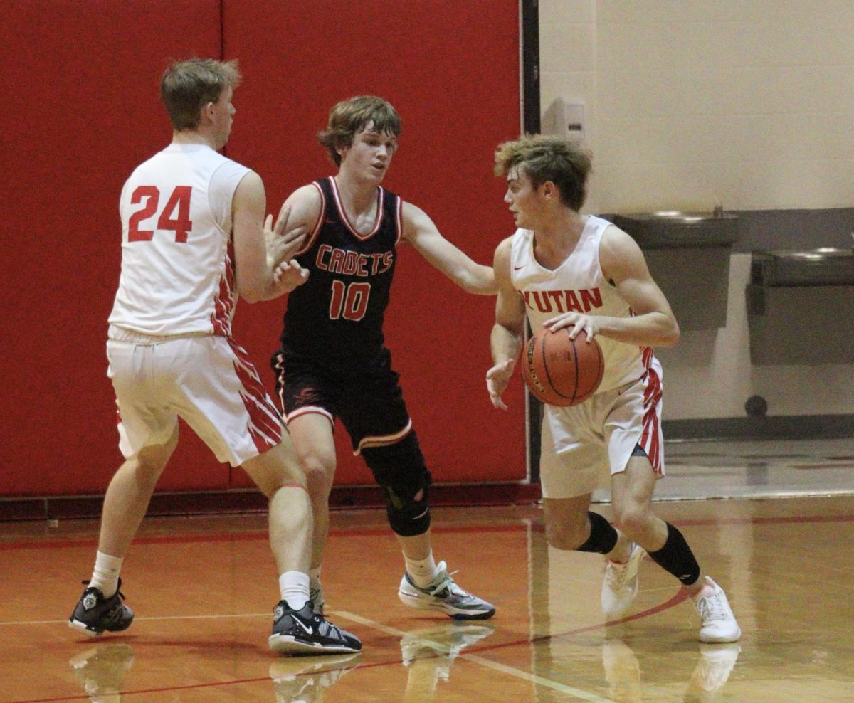 As senior Jack Edwards sets a screen on the defender, senior Joey Benjamin drives around the screen and into the hoop. Benjamin contributed two points and Edwards contributed four points to the teams total of 30 points against the West Point-Beemer Cadets.
