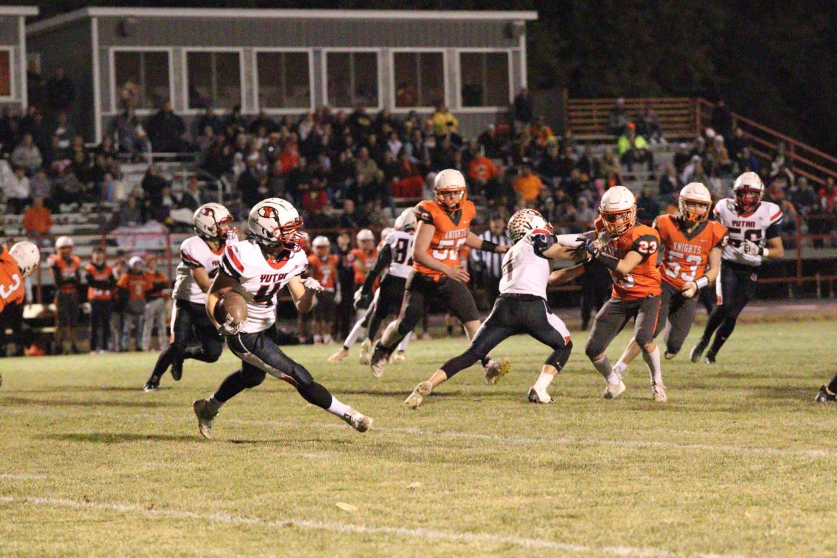 Senior Cole Smith attempts to rush outside the Knights defense. Smith averaged 23.3 yards on kickoff and punt returns.