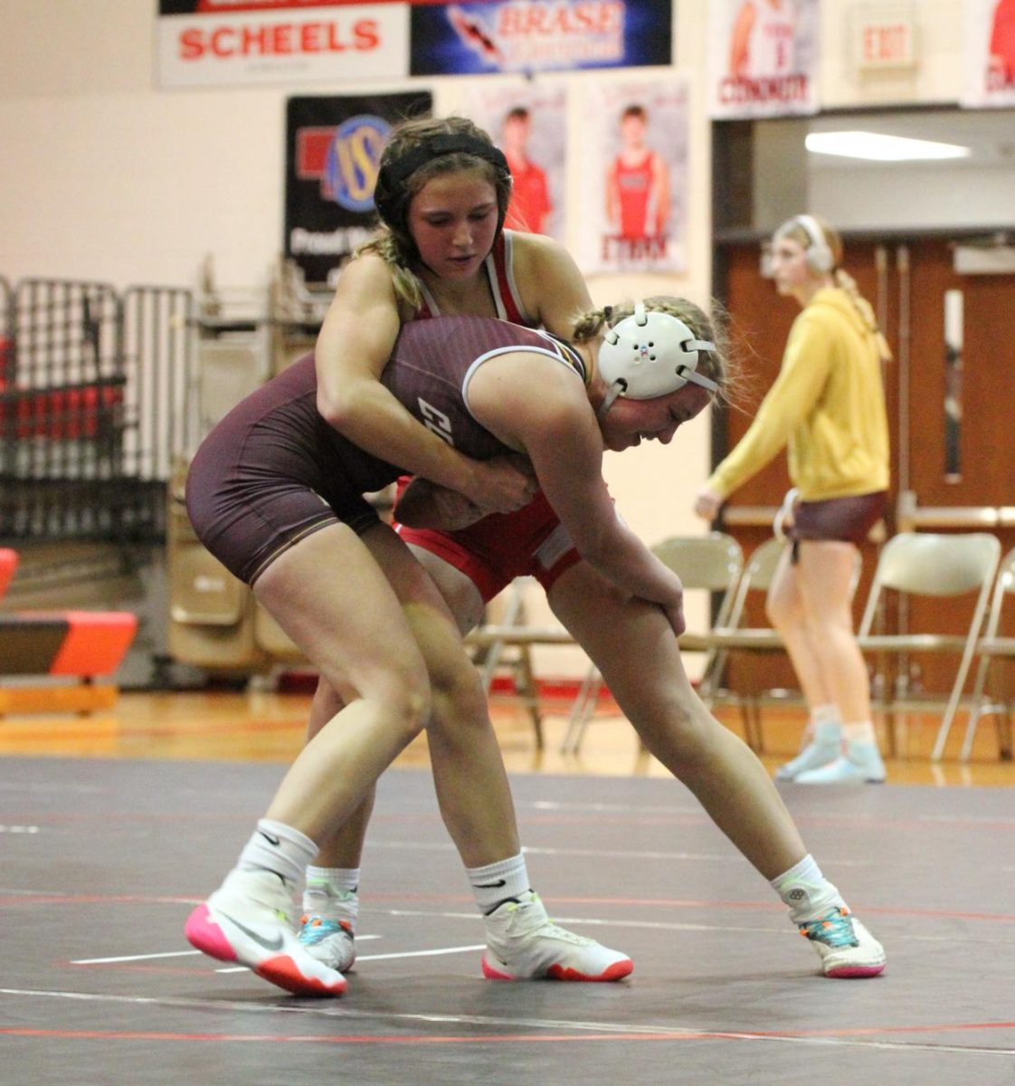Freshman Leah Thompson works to take down her Conestoga opponent. Thompson won the match #-#.