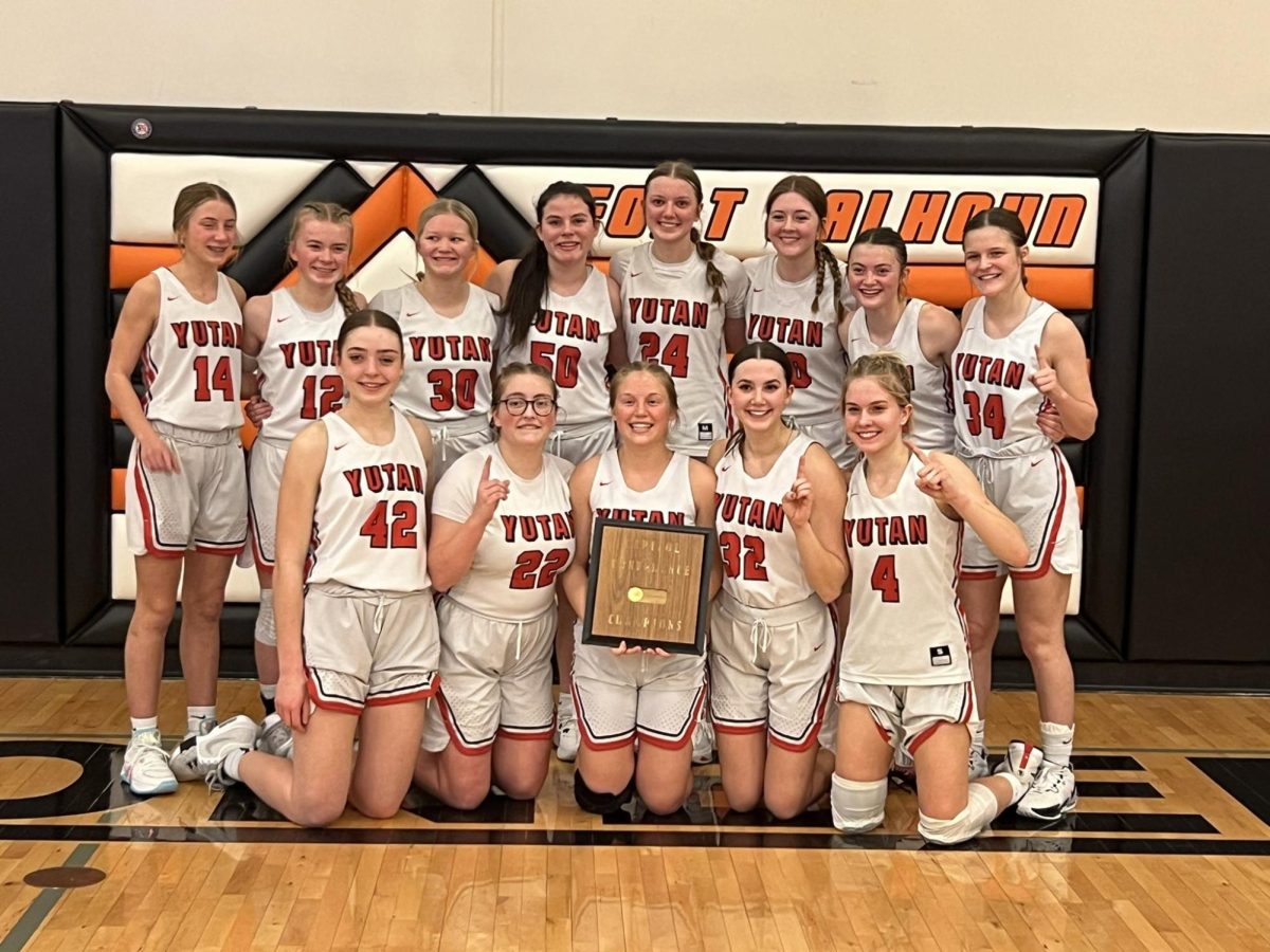 From left to right, Millie Dieckman, Reagan Wilson, Haley Kube, Maura Tichota, Jade Lewis, Emmy Tederman, Delaney Shield, Oliva Chapman, Jenna Trent, Mylee Tichota, Madison Wilson, Jenna Benjamin and Allison Kirchmann pose for a picture with their Conference trophy. This was the third year in a row that the Chieftains won the Conference tournament. 