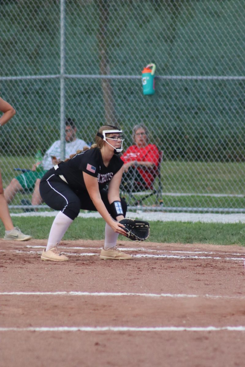 Senior Andi Nelson gets in position to field the ball. Along with softball, Nelson participates in cheer, one-act, speech, NHS, choir, and musical. 
