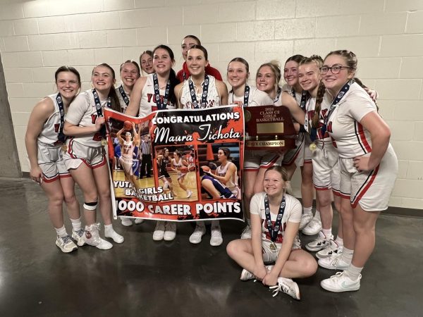 From left to right, Allison Kirchmann, Jenna Benjamin, Haley Kube, Emilia Tederman, Jenna Trent, Millie Dieckman, Maura Tichota, Mylee Tichota, Jade Lewis, Madison Wilson, Delaney Shield, Reagan Wilson and Olivia Chapman take a photo with their state trophy and medals. This was the first time the Chieftains have even won a game at the state championship.