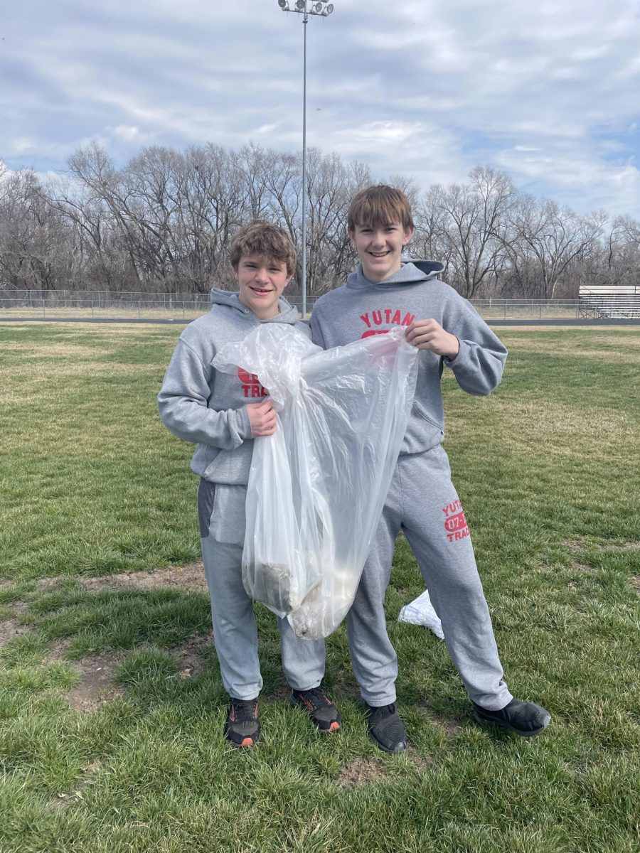 RAK Club founder and eighth-grader Kaleb Fenner poses for a picture with eighth-grader Kale Hoffer. The club did a trash clean-up in preparation for a home track meet.