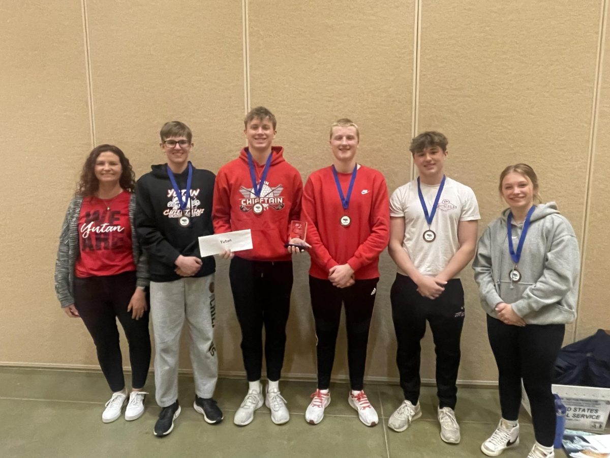 From left to right, Nealy Freeman, Bryce Kolc, Jack Edwards, AJ Arensberg, Tannen Honke, and Bella Tederman pose with their third place district trophy and medals. The team was one place away from qualifying for the state quiz bowl meet. 
