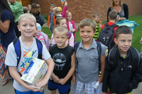 Currents Seniors Jack Edwards, Creek Kennedy, Derek Wacker and Cooper leather smile for a first day of first grade picture. Edwards, Kennedy, and Leather have been here since kindergarten, Wacker joined in first grade.