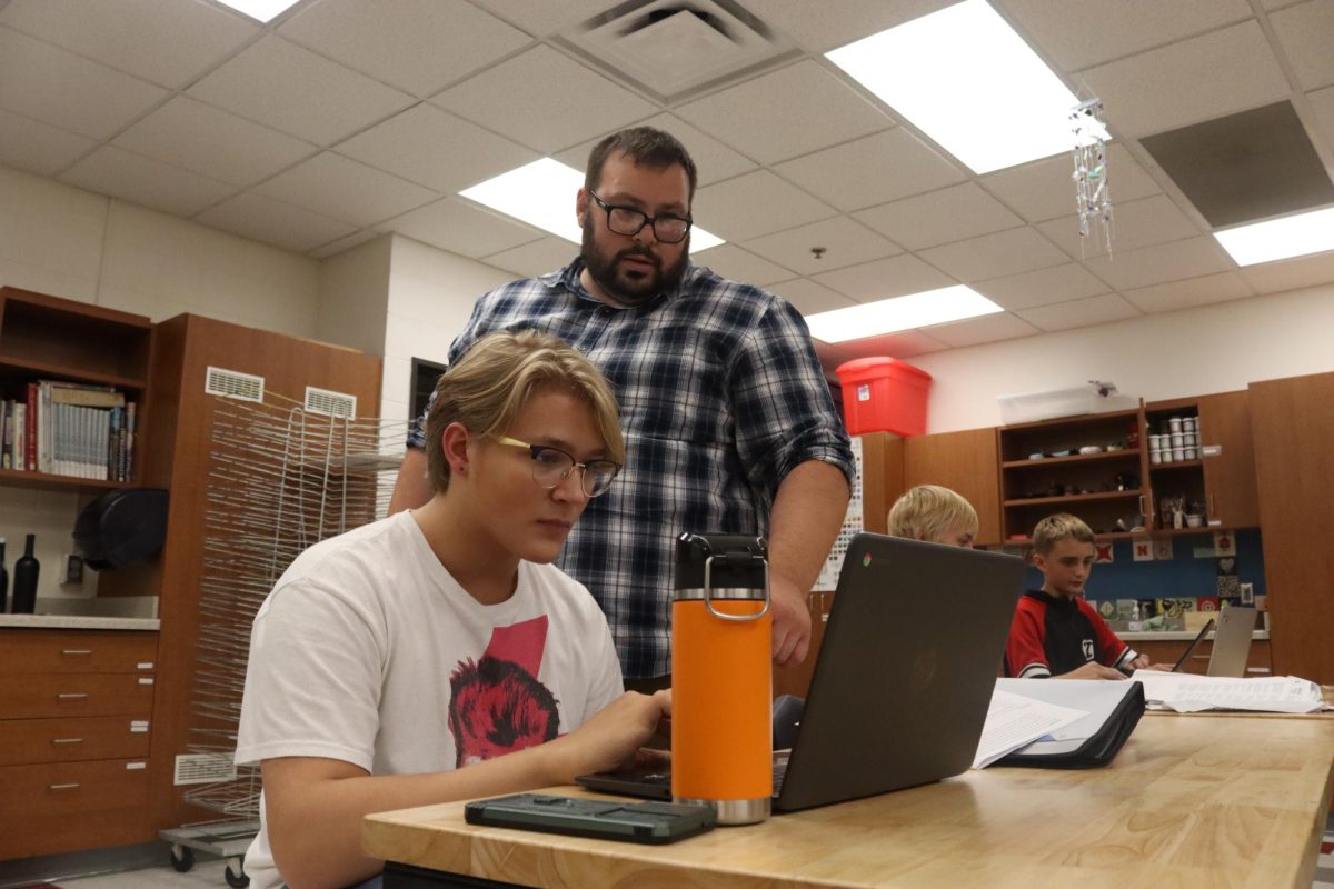 Teacher Micheal Swanson and Junior Mason Smith focus in on the chromebook during chieftain time. This year, students have chieftain time every day instead of twice a week. 