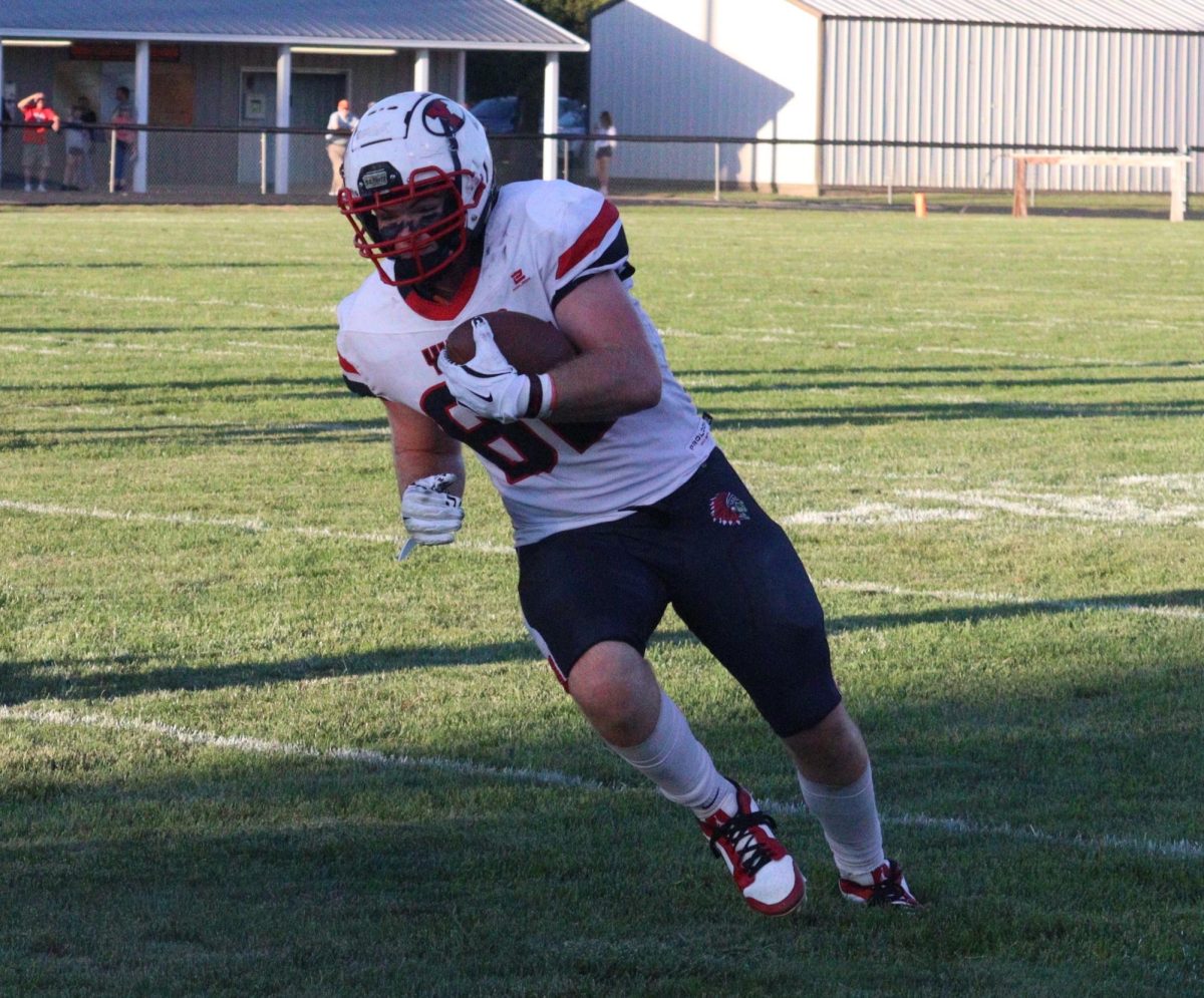 At Oakland-Craig, junior Owen Sutter runs the ball towards the end zone. During this game, Sutter had 3 receptions and 25 receiving yards. 