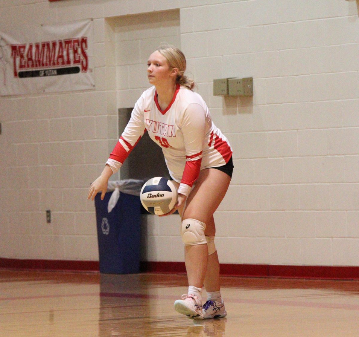 During a varsity match, freshman Morgan Long looks to serve the ball to the opposing team. So far this season, Long averages 0.7 aces per game. 