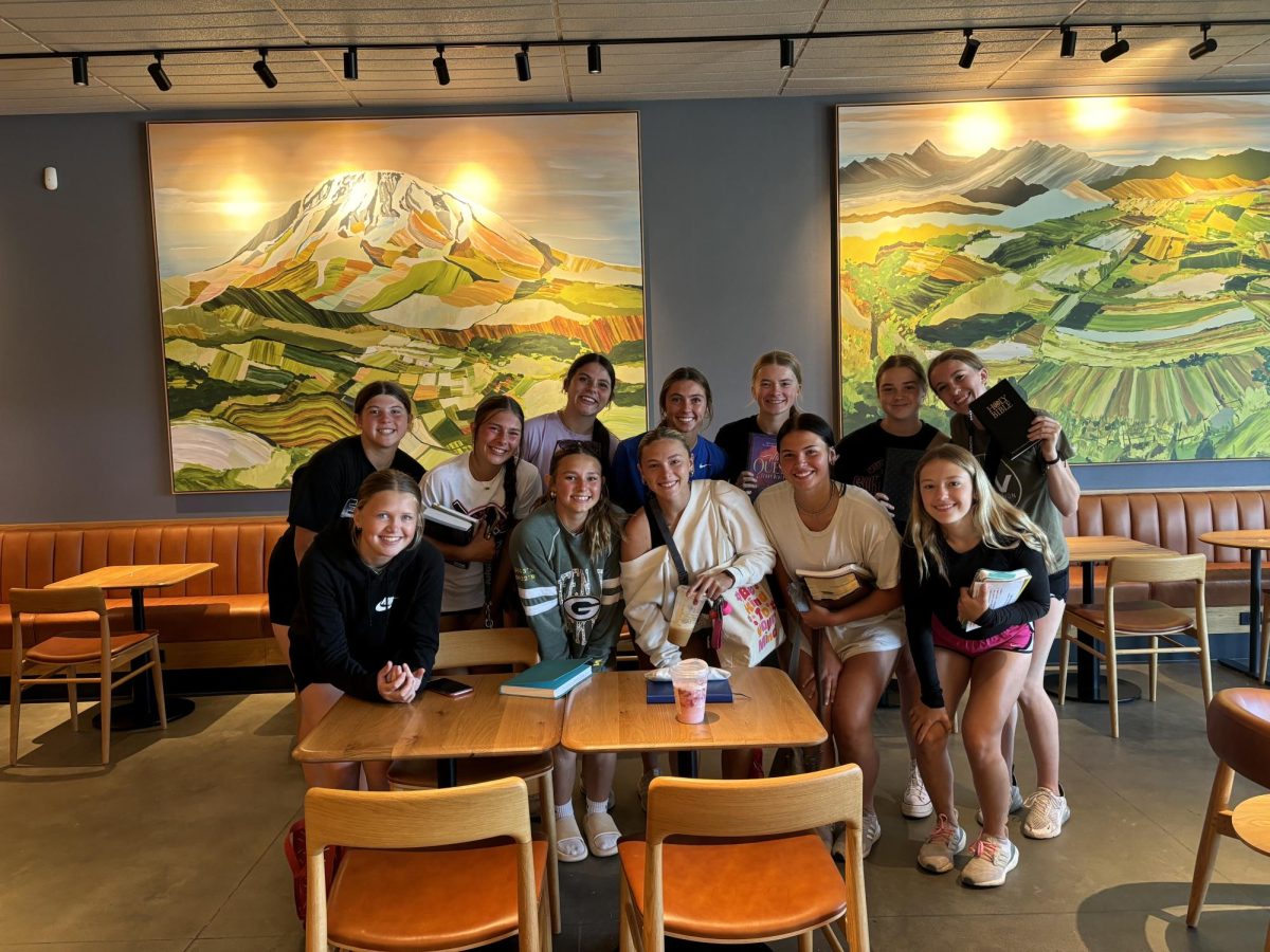 From left to right, _, Beth _, _ , Jenna Trent, Leah Thompson, Jordyn Campbell, Addi Jones, Delaney Shield, _, Addi Smith, Kylie Woster, and Molly Besch pose for a picture after a Bible study. 