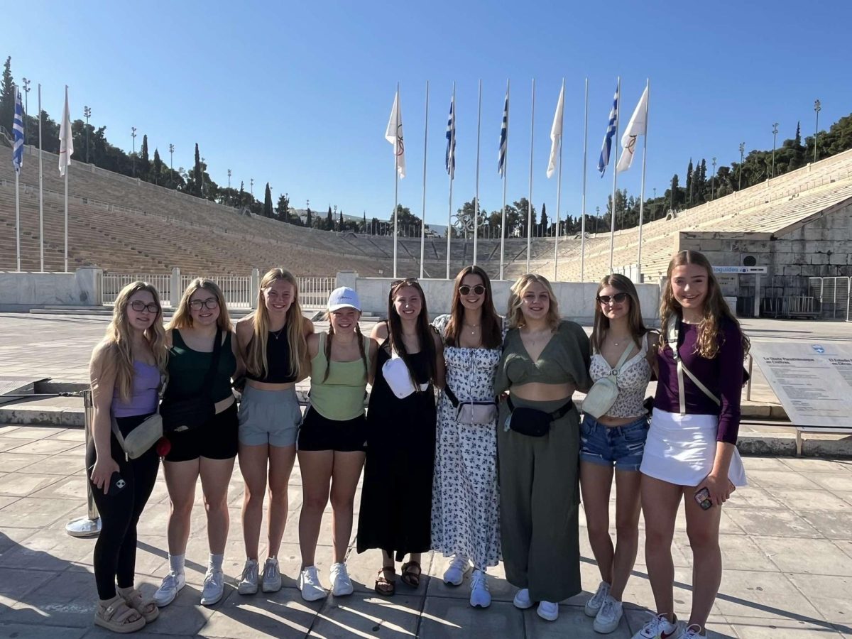 A group of Yutan students, including seniors Gabi Tederman, Libby Winn and Millie Dieckman, pose together in front of the Panathenaic Stadium. This was the site of the first modern Olympic Games in Athens, Greece, in 1896. 