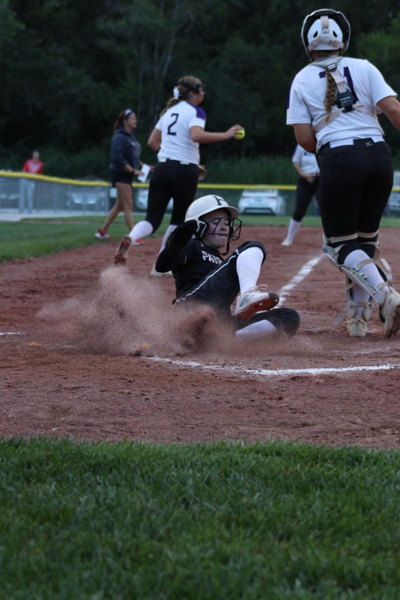 Junior Delaney Shield slides onto _ base. Shield favorite position in softball is _.