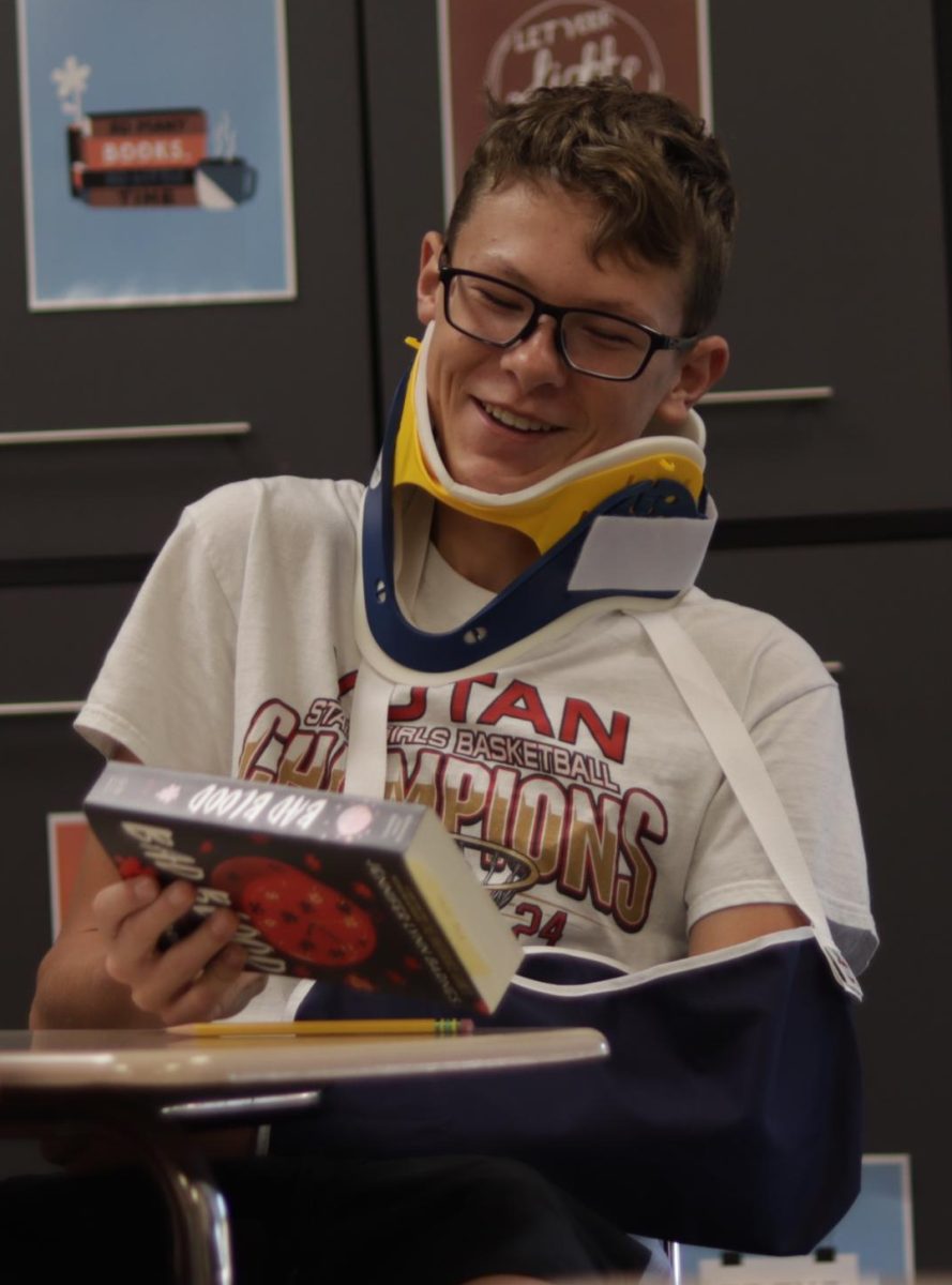 Freshman Charlie Tasich enjoying Wambulance Wednesday. Tasich wore a neckbrace, arm sling and head wrap.