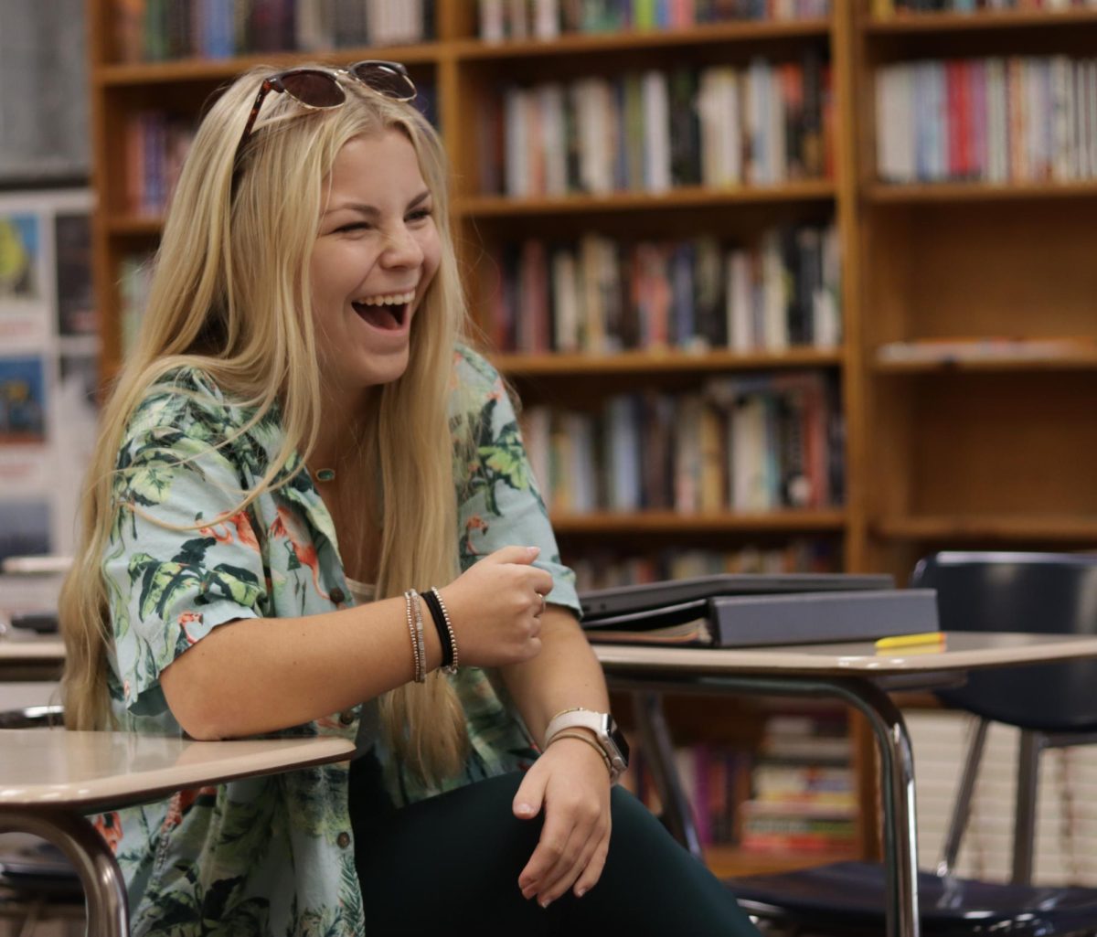 Sophomore Halle Arlt laughs with her Journalism classmates. Hawaiian day was one of the more popular dress up days and 80 percent of the school dressed up. “My favorite dress-up day was Hawaiian day because it's more of an easy dress up day and you can really notice when people participate,” Arlt said.