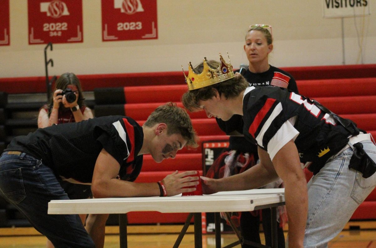 At the homecoming pep rally, seniors Owen Egr and Tannen Honke look to see who can grab a cup the fastest. The game started with five seniors and five staff members and ended with only Egr and Honke left in the final round. “At the end of the day I gave it my all. Sure, there were things I would have done differently, but all that matters is that Owen performed when the pressure was at its highest and I didn’t,” Honke said.