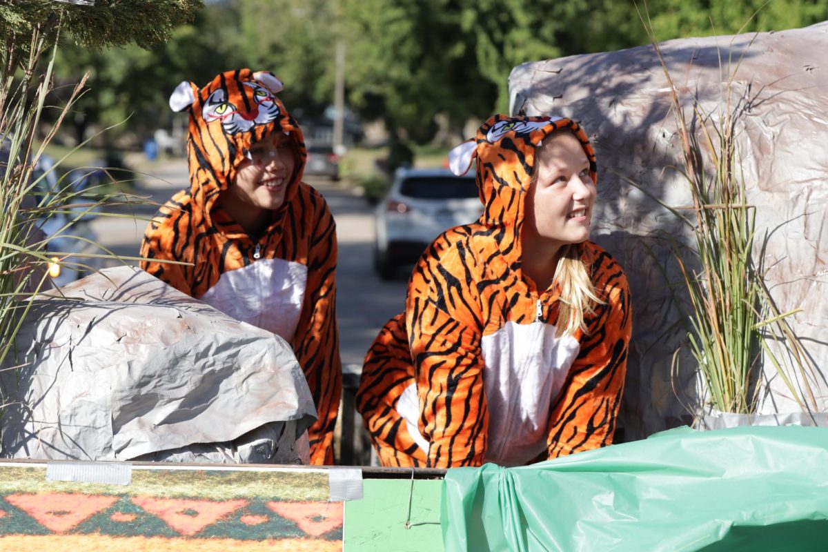 Seventh graders Ella Eikmeier and Haiden Schake act out Tekamah-Herman's mascot the tiger. Griffin Ell dressed up as a chieftain as well.