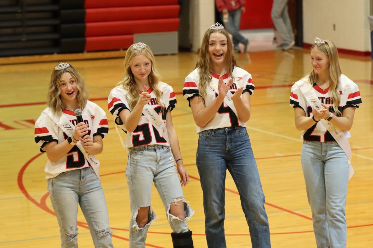 At the homecoming pep rally, seniors Britney Zeleny, Mckenna Jones, Amelia Dieckmann and Gabi Tederman praise their volleyball team’s success so far this season. All four girls were also on homecoming court. “My favorite part about being on homecoming court was getting ready with all the other nominees Friday morning before the football game,” Jones said.