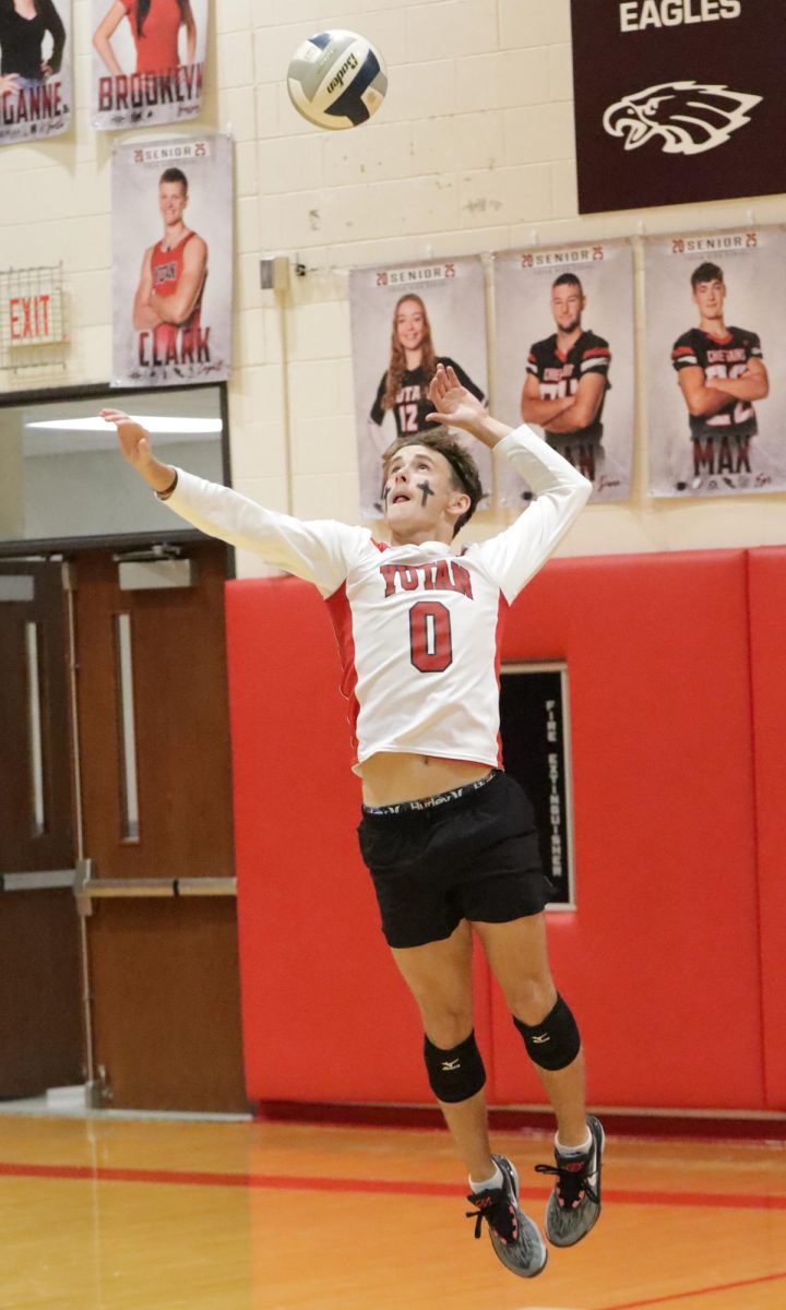 Junior Carson Jurey serves the volleyball to the seniors during powderbuff. Jurey's team won one set out of two.