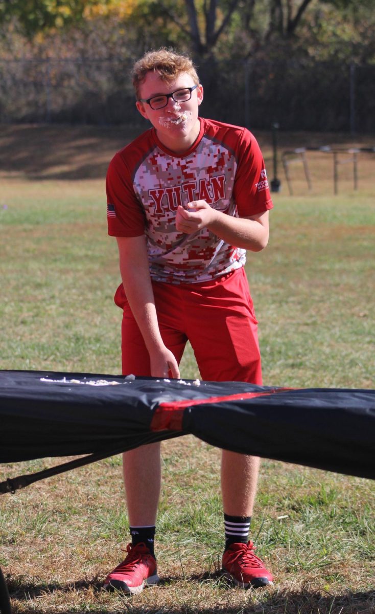 Eighth grader Klay Merryweather finishes his third cupcake in the cupcake eating contest. This is Merryweather’s second year doing the cupcake eating contest. “My favorite part is definitely eating the cupcakes,” Merryweather said.  