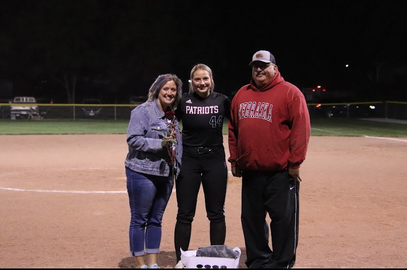 Rylee Kirchmann with her parents on senior night. The Patriots won the game on senior night.