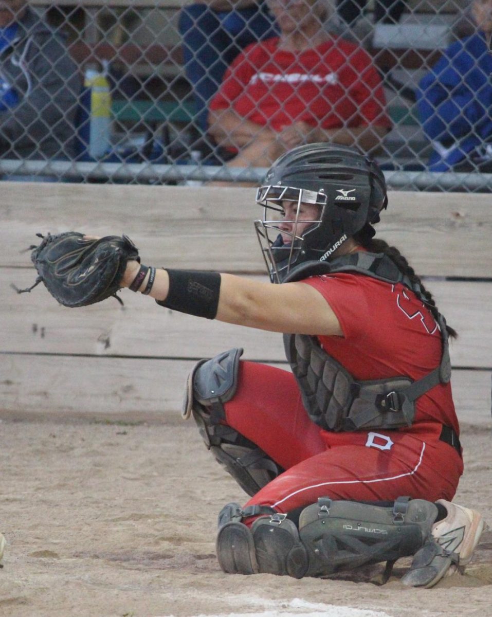 Junior Jenna Trent frames the ball as a catcher. When Trent is not catching, she plays first or third base.