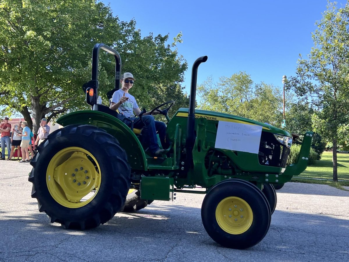 Holden DeGroff poses for a picture after winning intermediate tractor driver.