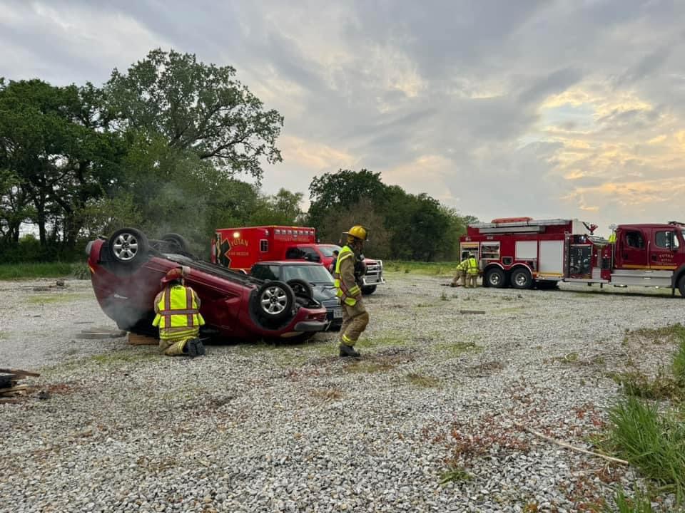 During training, Yutan firefighters practice responding to a car on fire. Last year, the fire department responded to 25 car accidents.