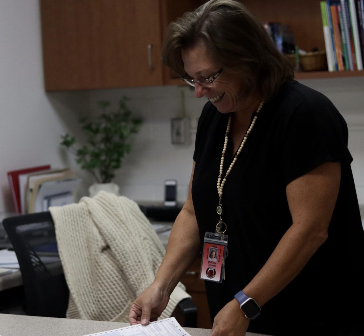 Counselor Missy Chvatal reviews new student transcripts. A focus of Chvatal's this year is focusing on getting to know students on a personal level. 