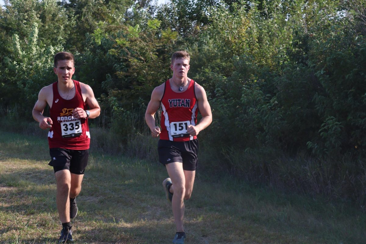 Cogdill running past an opposition during a cross country meet. Clark did not run much last year because of a knee and foot injury, but battled through and got stronger for his senior year.