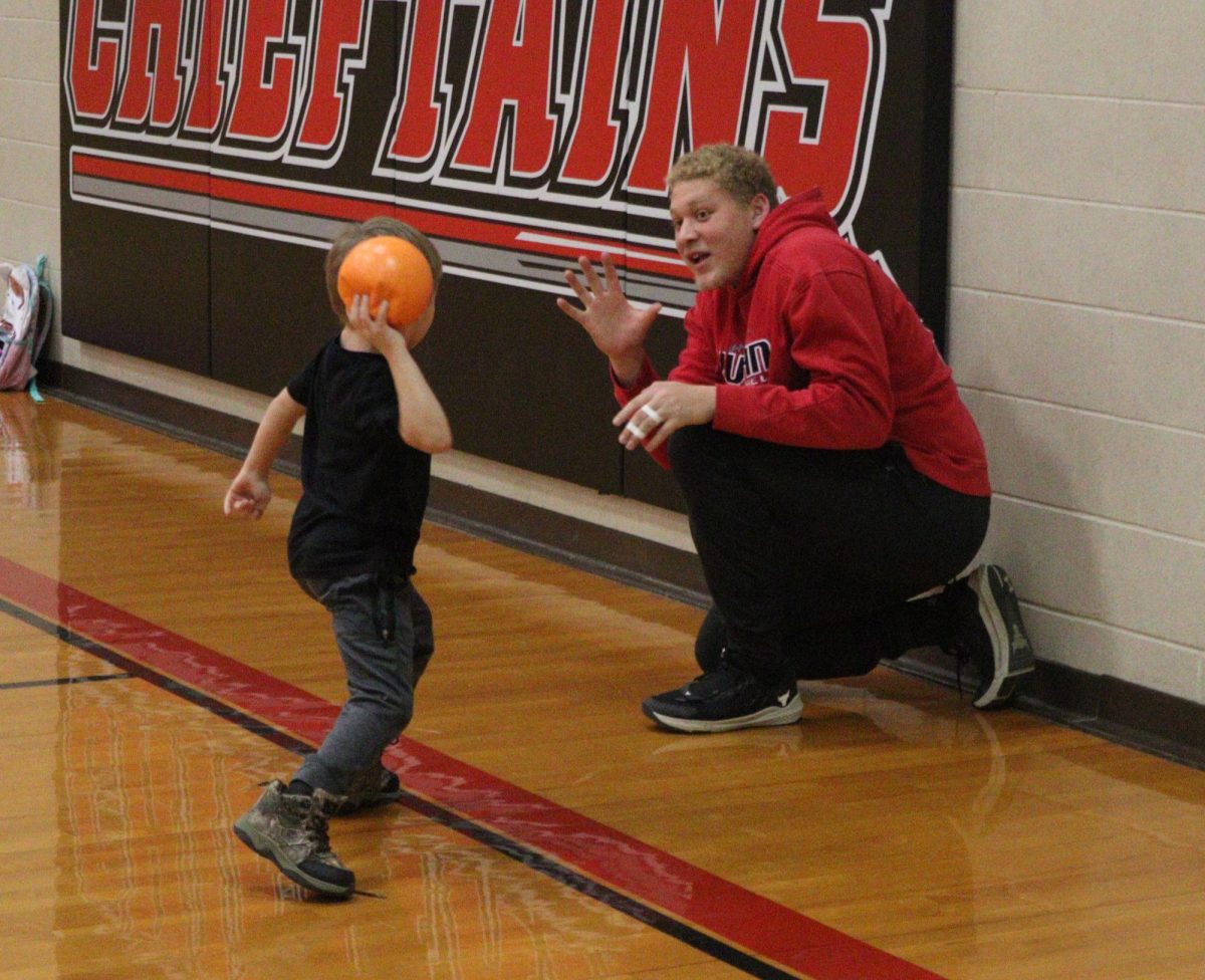 Sophomore Peyton Reed plays dodgeball with one of the Chieftain Buddies. As of first semester, there were 50 pairs of buddies.