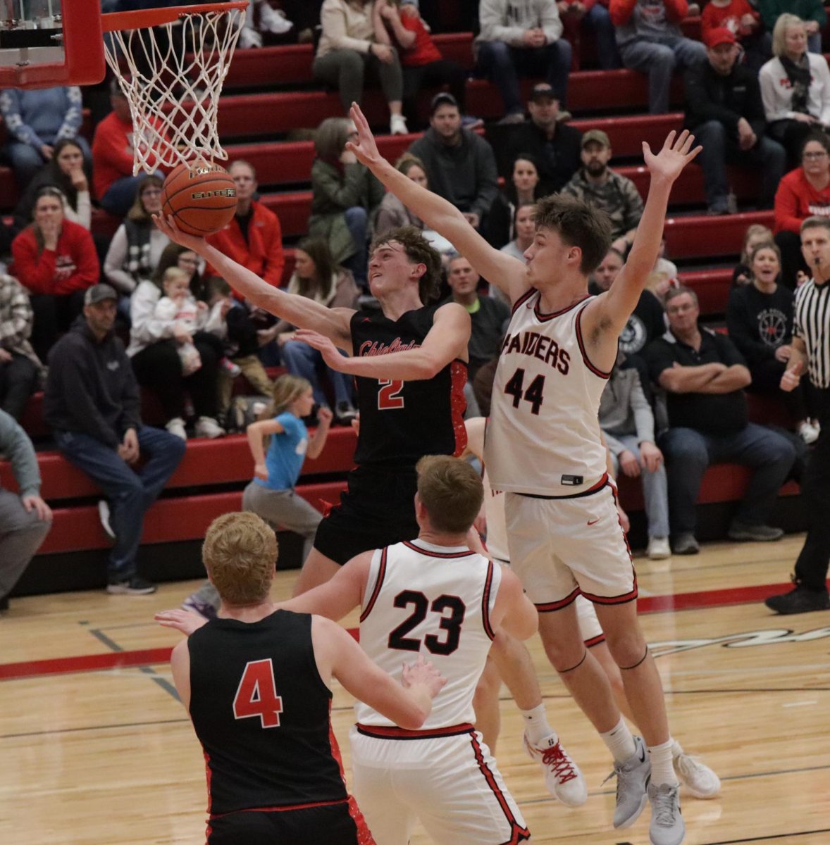 During a boys basketball game against Mead, sophomore Ryan Maguire drives to the hoop. Maguire averages 11.3 points per game. 