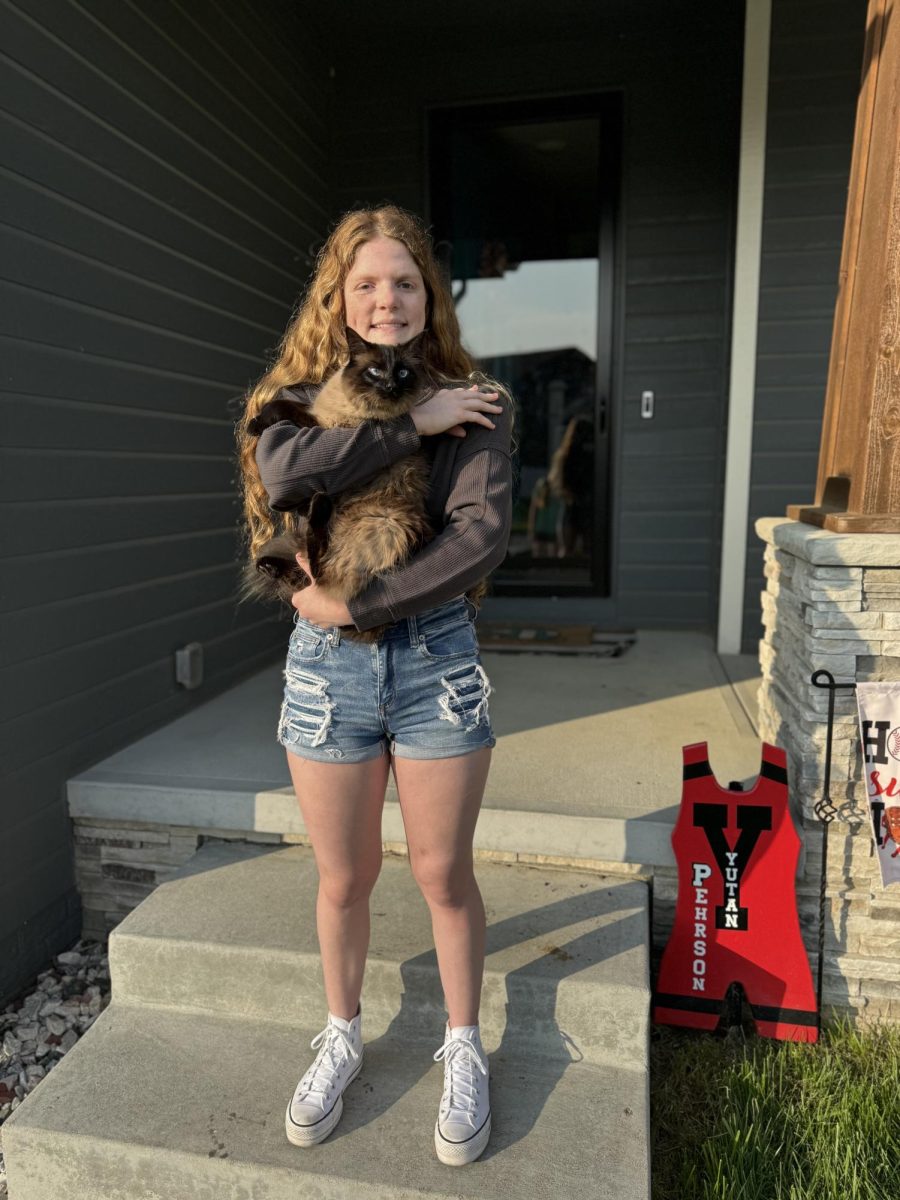 Senior Aubrie Pehrson holds her cat Luna on the first day of school. Pehrson also has two other cats, Molly and Meow Meow.